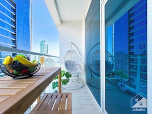 Apartment (0 Bedroom) | Interior - Balcony Bliss: Cozy Studio With Marina Views (Dubai)