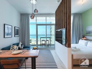 Apartment (0 Bedroom) | Interior - Balcony Bliss: Cozy Studio With Marina Views (Dubai)