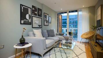 Apartment (1 Bedroom) | Living area | 37-inch Smart TV with cable channels