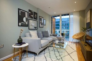 Apartment (1 Bedroom) | Living area | 37-inch Smart TV with cable channels