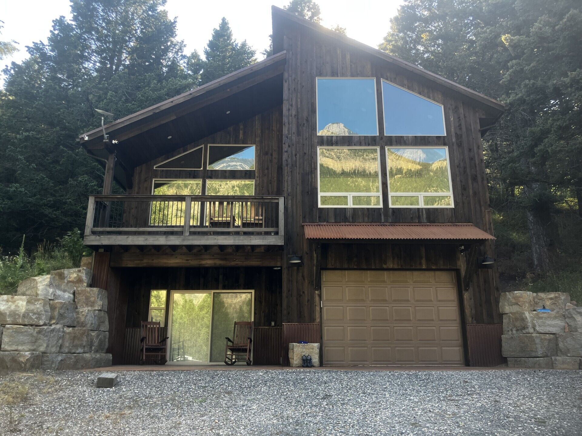 Our place with reflection of Castle Rock off windows