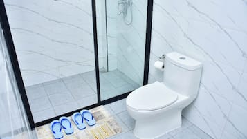 Shower, free toiletries, slippers, towels