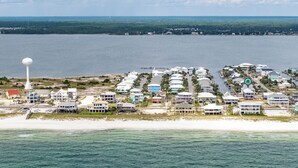 A coastal residential area with houses, a water tower, and a marina. - Spacious new build 6-bedroom 6.5 bath house in gorgeous Navarre Beach (Navarre)