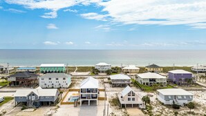 A coastal residential area with various houses, some with balconies and a few with visible swimming pools. - Spacious new build 6-bedroom 6.5 bath house in gorgeous Navarre Beach (Navarre)