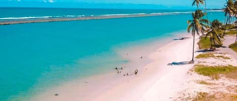 On the beach, white sand