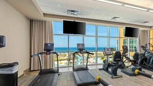 A gym with treadmills, elliptical machines, and a view of the ocean. - Brand New Phoenix Gulf Tower 2507 /Lazy River/Beach
Your Vacation Getaway! (Orange Beach)