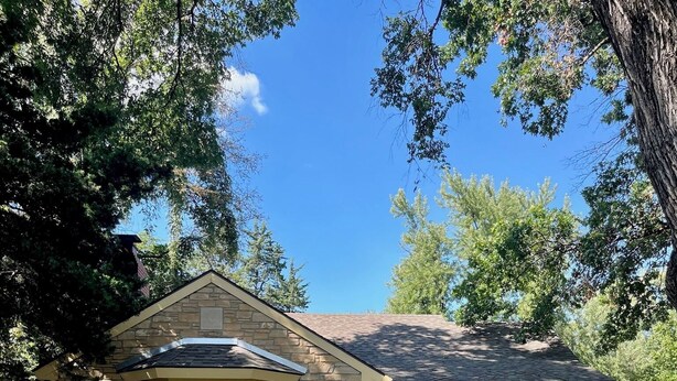 A stone house with a front porch, a pathway leading to the entrance, and a well-maintained garden. - Cozy & Spacious 2Bed, 2Bath in the heart of Winfield (Winfield)