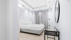A modern bedroom with a bed, a glass table, and a large mirror on the wall. - Silkhaus Safa 47 A (Riyadh)