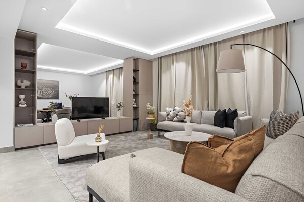 Royal Apartment | Living area | 50-inch Smart TV with digital channels - Silkhaus Rose Residency 36 (Riyadh)