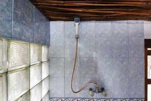 A shower with a hose, tiled walls, and a wooden ceiling. - Bagus Bay Homestay (Tuktuk Siadong)