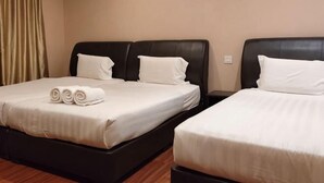 A hotel room with two beds, each with a black headboard and white bedding. - Grandview VIP Home (Gali)