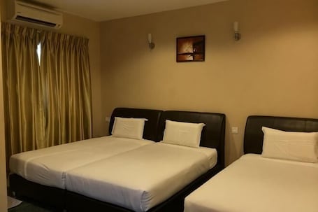 A hotel room with two beds, a painting on the wall, and an air conditioning unit.. Grandview VIP Home