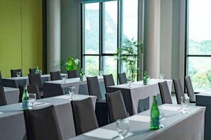 A restaurant with multiple tables set for dining, large windows, and indoor plants. - TUI BLUE The Haven Ipoh (Ipoh)