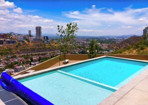 Enjoy a refreshing swim with a stunning city view from our rooftop pool.