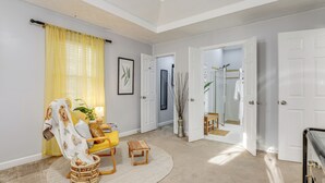 A spacious living room with a yellow chair, a wooden coffee table, and a large mirror. - ~ 30 Mi to Atlanta - ‘The Wellness Manor’ w/ Deck! (Snellville)