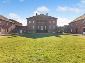 A large, symmetrical building with a central courtyard, multiple windows, and a traditional architectural style. - The Old Bakery - UK48319 (Berwick-Upon-Tweed)
