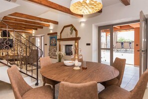 Enjoy meals in this dining area with a round table and six comfortable chairs.