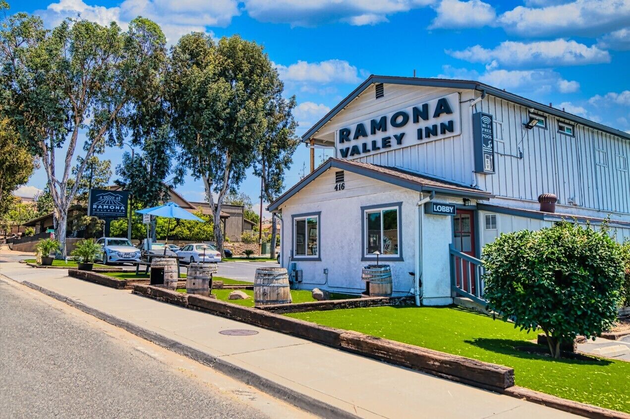 A rustic, single-story building with a sign reading "Ramona Valley Inn."