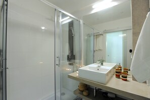 Shower, hair dryer, towels, toilet paper