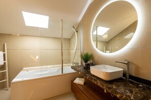 Shower, hair dryer, towels, toilet paper