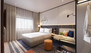 A modern hotel room with a large bed, a sofa, a small table, and a decorative wall piece. - Holiday Inn Express Bangkok Phayathai by IHG (Bangkok)