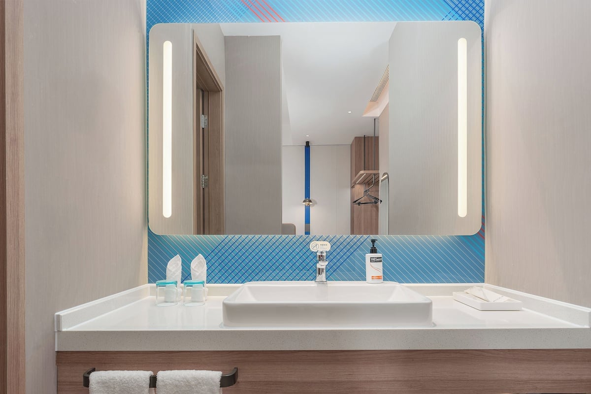 Shower, hair dryer, slippers, towels