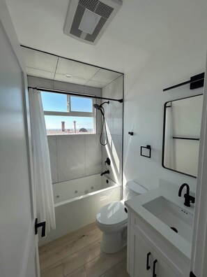 Shower, hair dryer, towels, shampoo