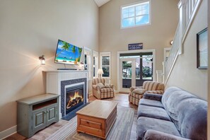 Smart TV, fireplace, books, stereo