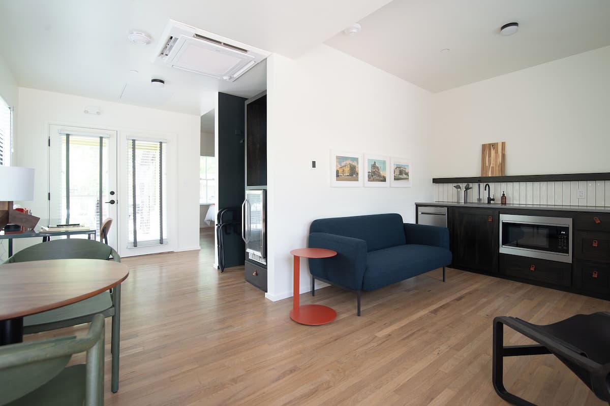 Superior Studio Suite, Courtyard View | Living area | TV