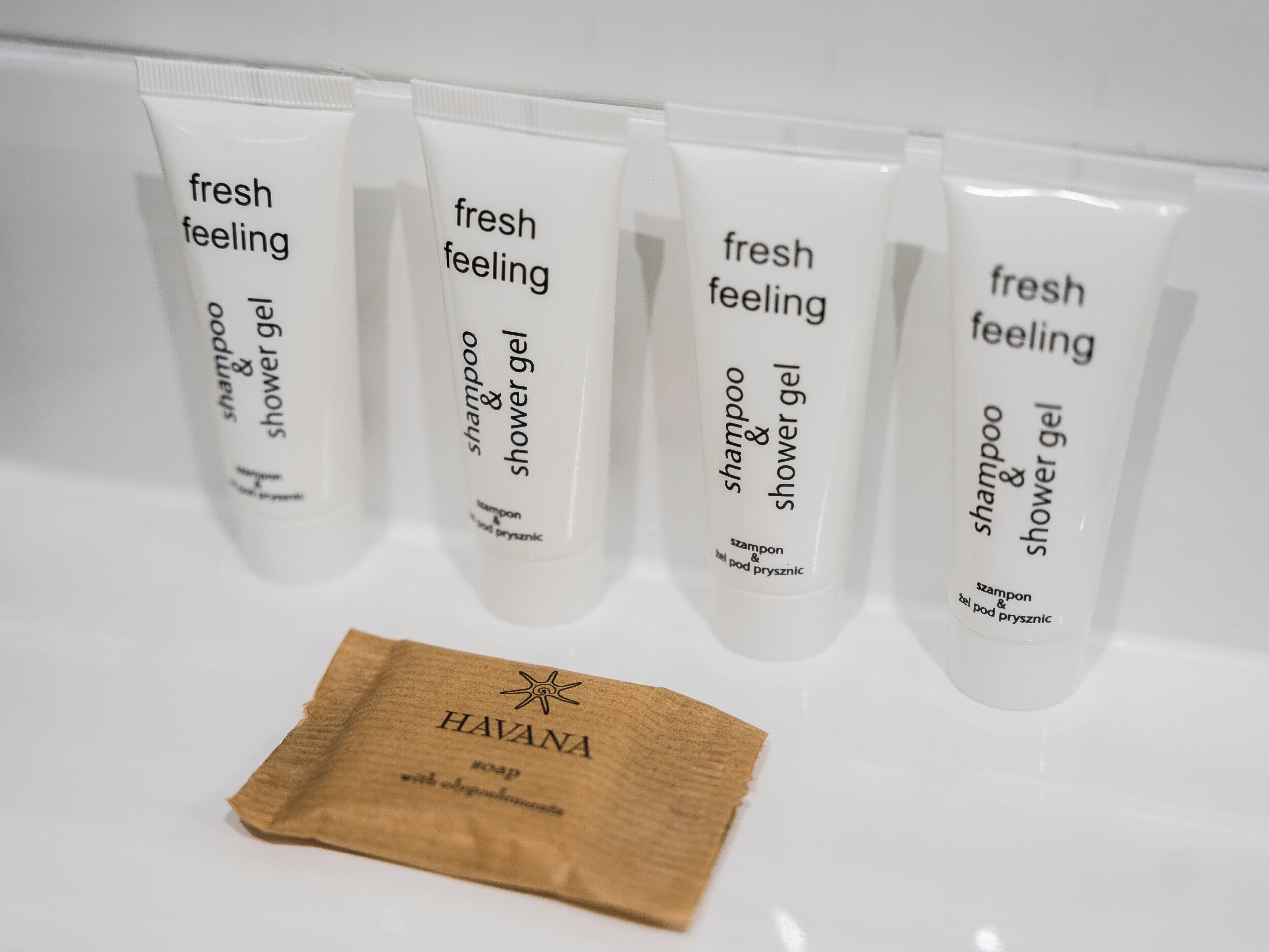 Four tubes of 'fresh feeling' shampoo and shower gel and a small brown packet labeled 'HAVANA soap with organic ingredients'.