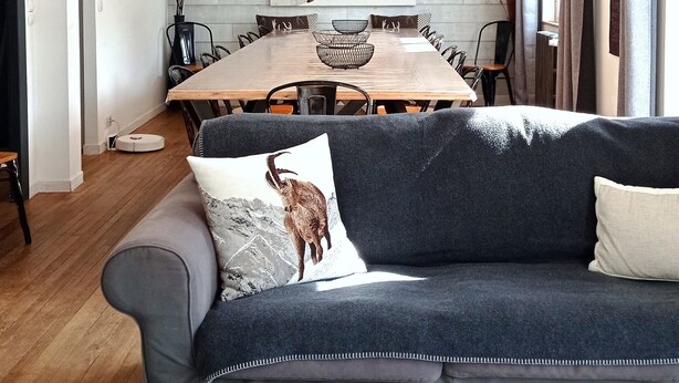 A modern living room with a wooden dining table, a gray sofa, and a geometric pendant light. - Chalet "Sublime Chalet 14 Pers Spa Extrieur" with Mountain View (Cauterets)