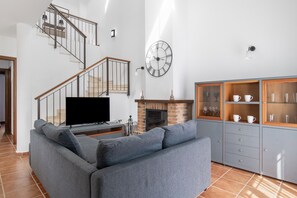 TV, fireplace - Holiday Home 'Las Lagunetas' with Mountain View, Shared Pool and Private Terrace (Benalup Casas Viejas)