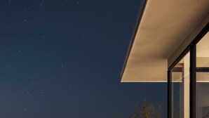 A modern house with a pool, a clear night sky, and a view of the ocean. - Unique luxury Ocean view villa steps from the beach (Cóbano)