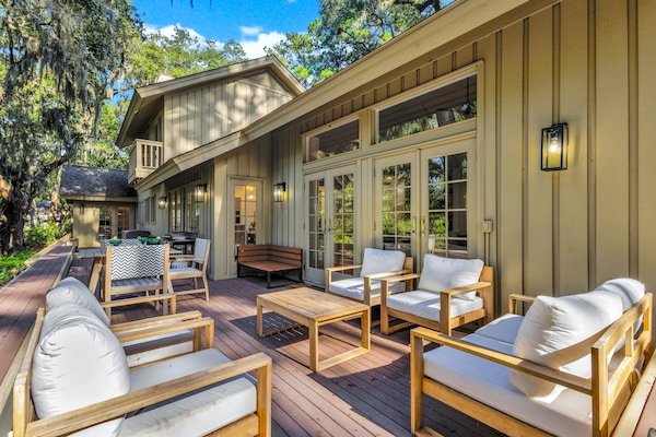 Step from the living room or kitchen onto a spacious deck, a serene retreat that perfectly blends indoor and outdoor living.
