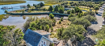 One bedroom oasis with marina and marsh views! Heart of the island with one golf cart