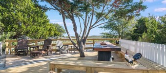 One bedroom oasis with marina and marsh views! Heart of the island with one golf cart
