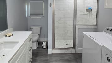 Shower, towels, soap, toilet paper