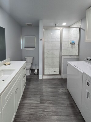 Shower, towels, soap, toilet paper