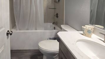 Shower, towels, soap, toilet paper