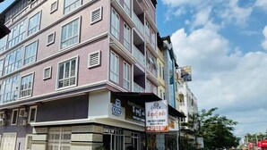 A multi-story building with a coffee shop on the ground floor named 'The Cozy Corner Budget Hotel'. - The Cozy Corner-Budget Hotel (Kampot)