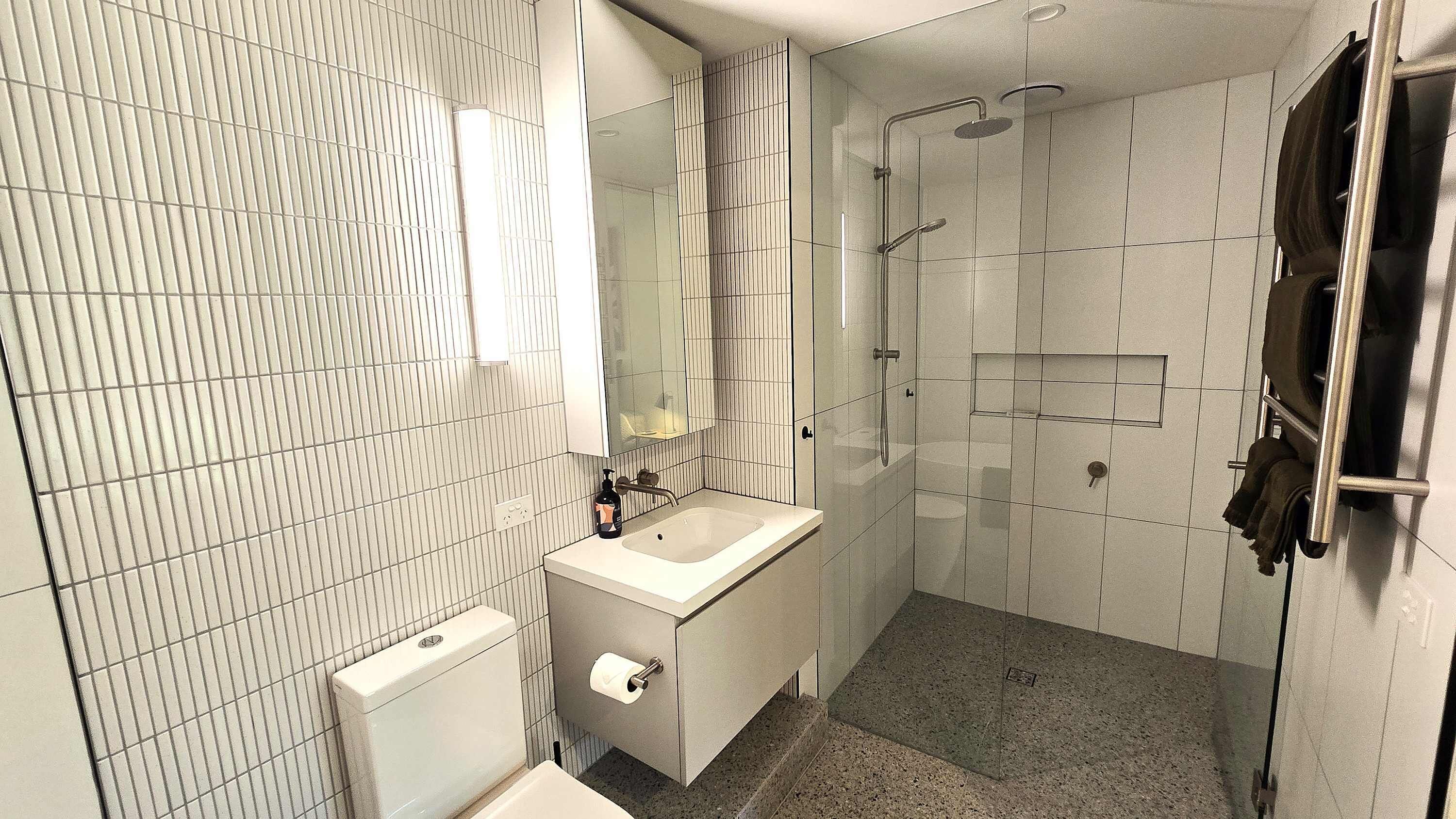 Shower, hair dryer, towels, shampoo