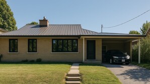 A single-story house with a covered garage, a front lawn, and a driveway leading to the garage. - Entire house 3BR, Pets, kitchen, Parking, Laundry, Large Fenced backyard, WiFi (Kitchener)
