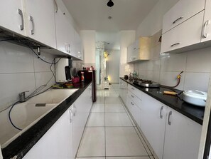 Fridge, stovetop, cookware/dishes/utensils