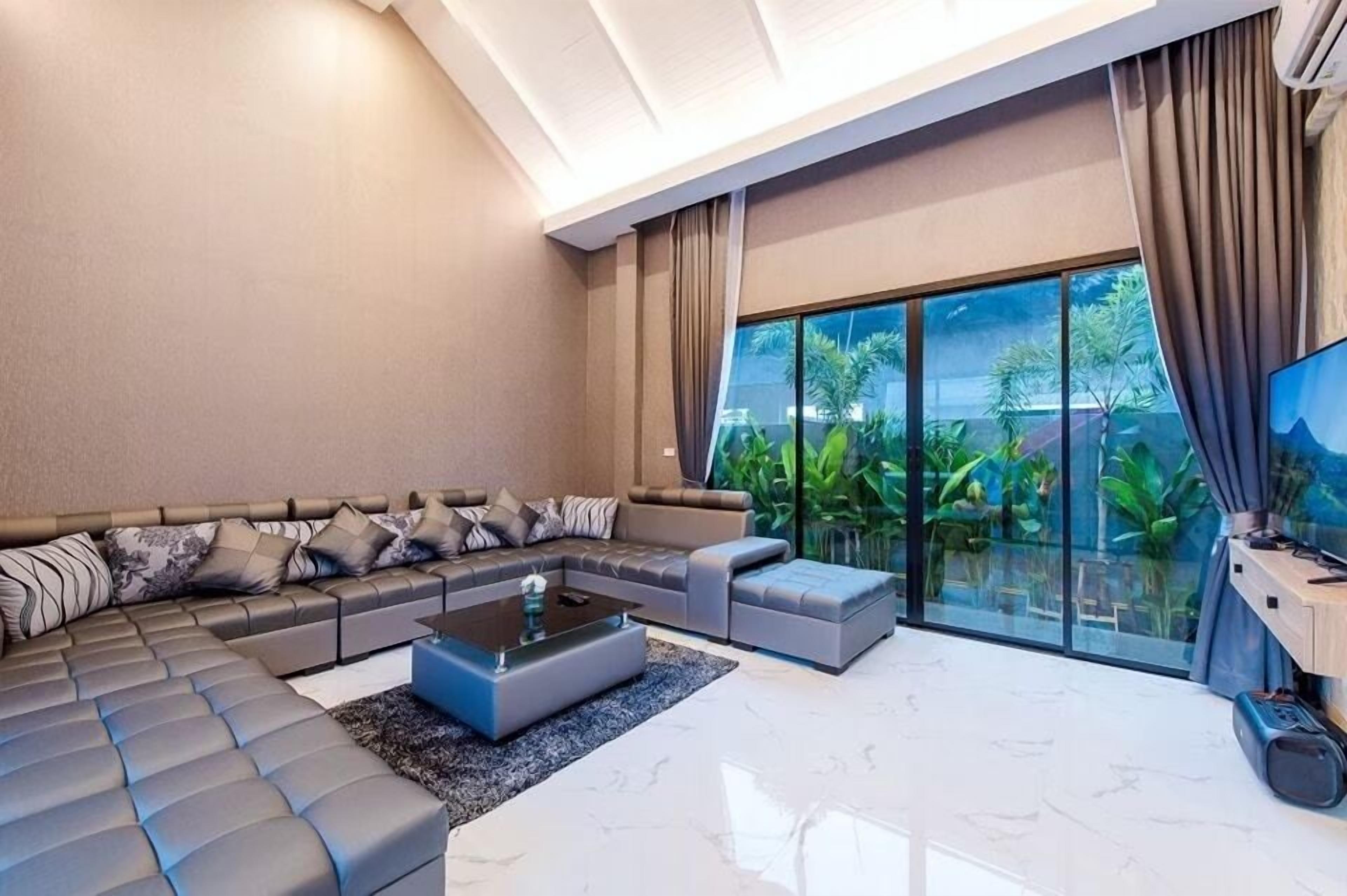 Villa, Pool View | Living area | 32-inch flat-screen TV with cable channels
