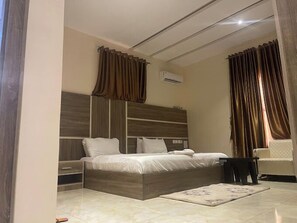 Deluxe Room, Balcony, City View | Desk, laptop workspace, iron/ironing board, free WiFi - SoulCare Gardens Hotel (Sokoto)