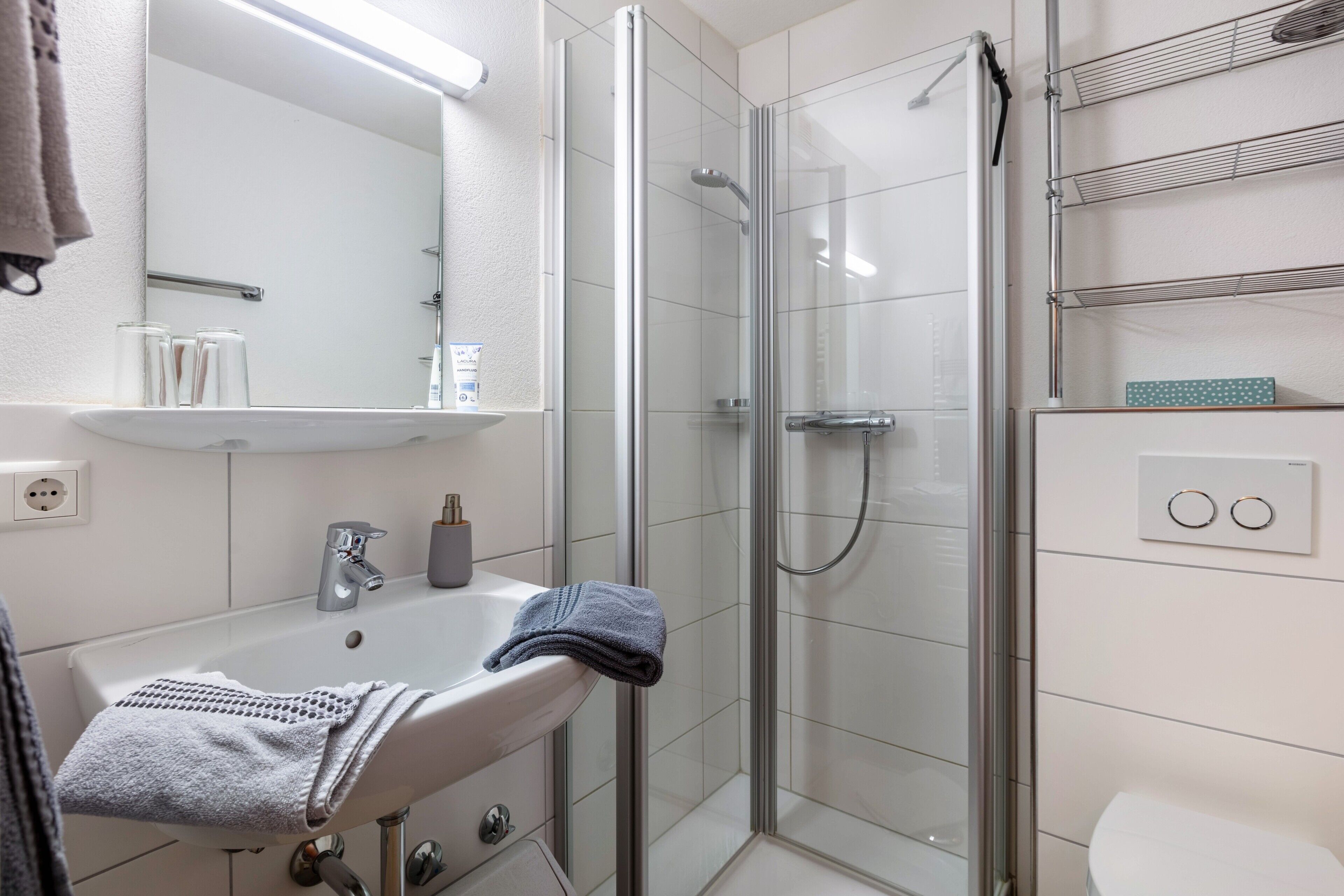 Shower, hair dryer, towels