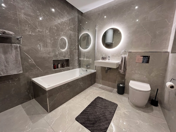 Shower, hair dryer, towels, soap
