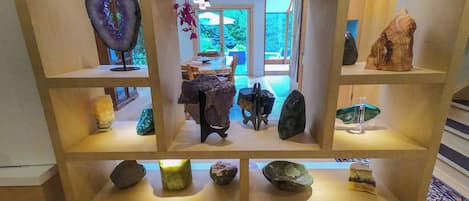 A display of various minerals and rocks on shelves.