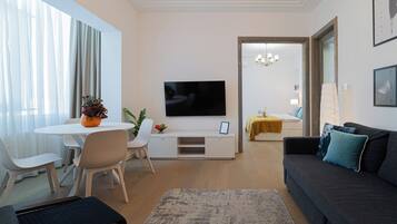 Comfort Apartment, 2 Bedrooms, Balcony, City View | Living area | 42-inch Smart TV with cable channels, Netflix, streaming services