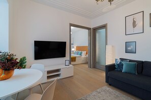 Comfort Apartment, 2 Bedrooms, Balcony, City View | Living area | 42-inch Smart TV with cable channels, Netflix, streaming services - Top-Floor Romanian Athenae 2BR Apartment, Quiet City Views (Bucharest)